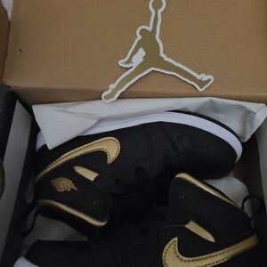 Jordan Black and Metallic Gold Mid Sneakers